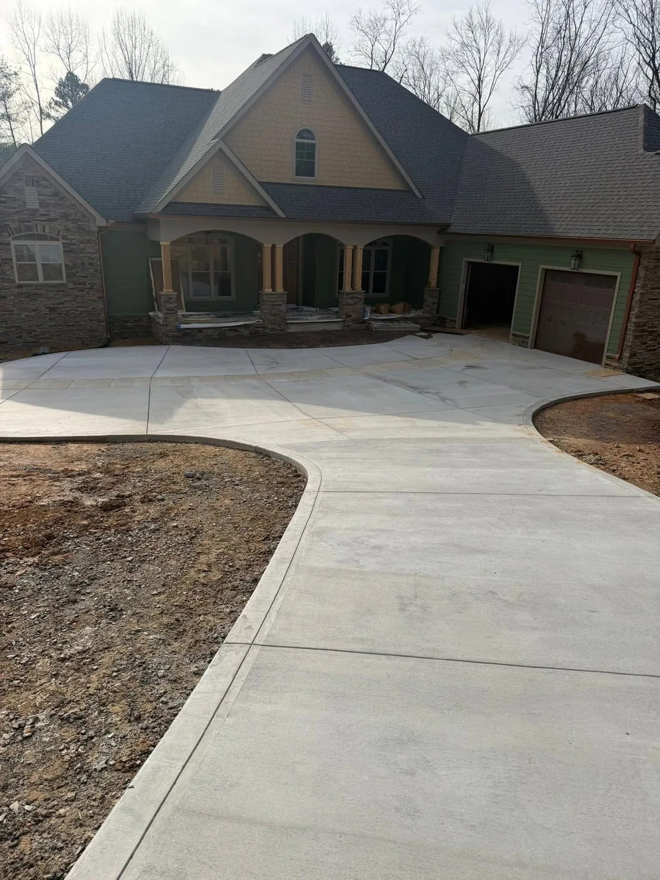 Curved concrete driveway and front entry