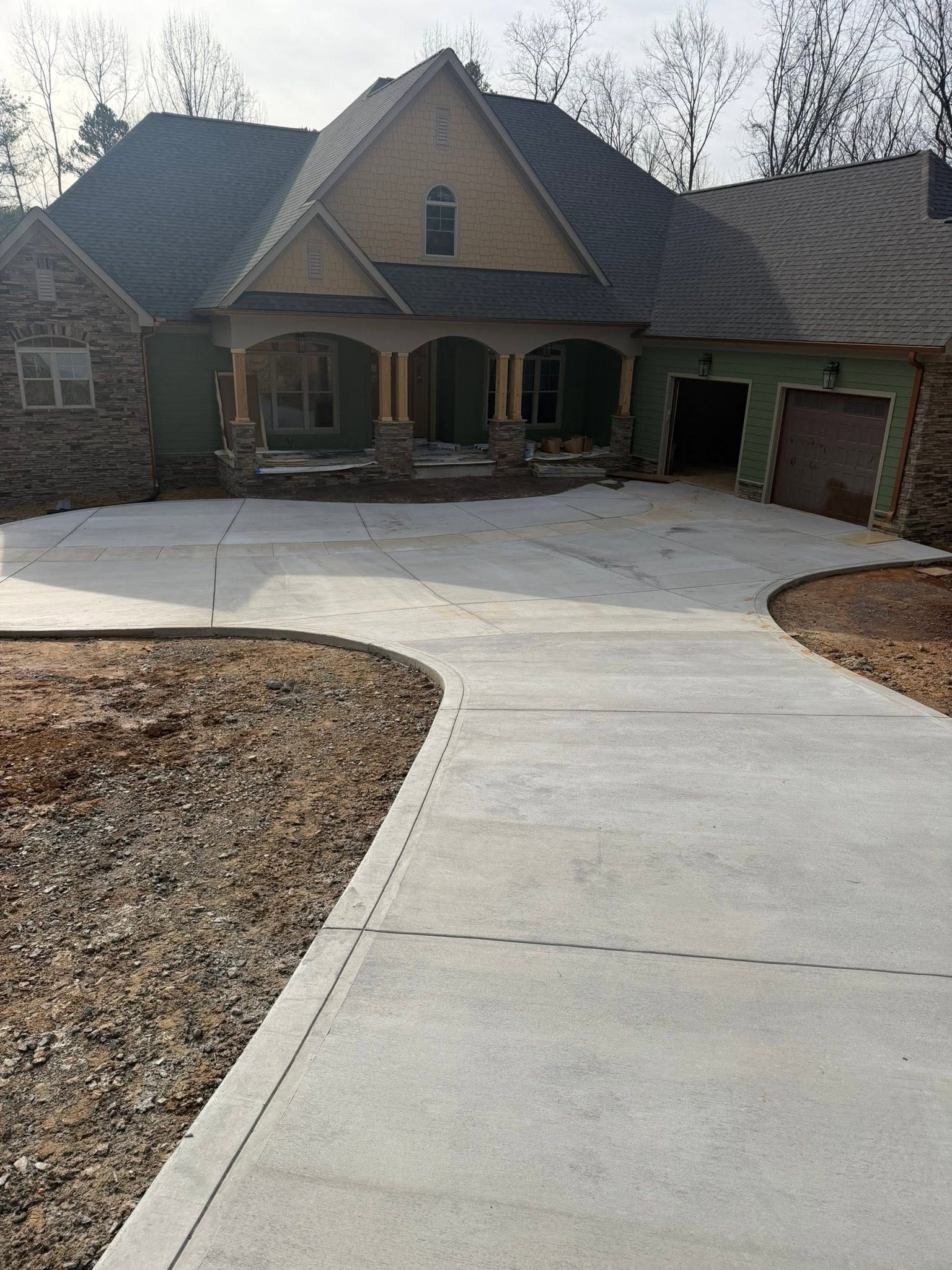 Curved concrete driveway and front entry