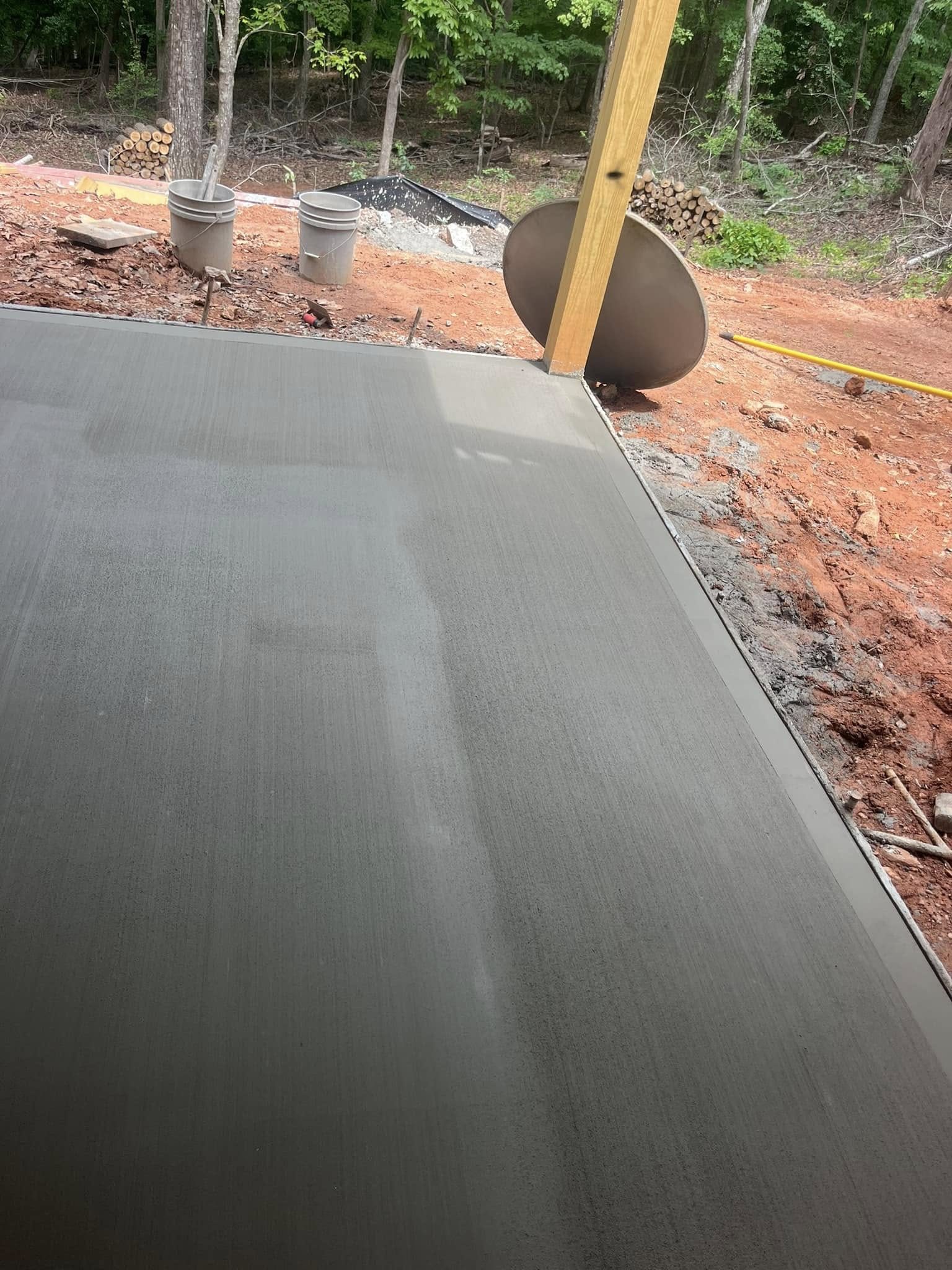 New concrete landing slab at a covered structure